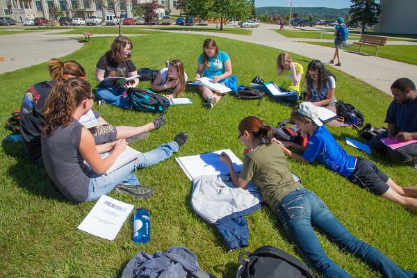 UAF students attend a summer class outdoors on the Fairbanks campus